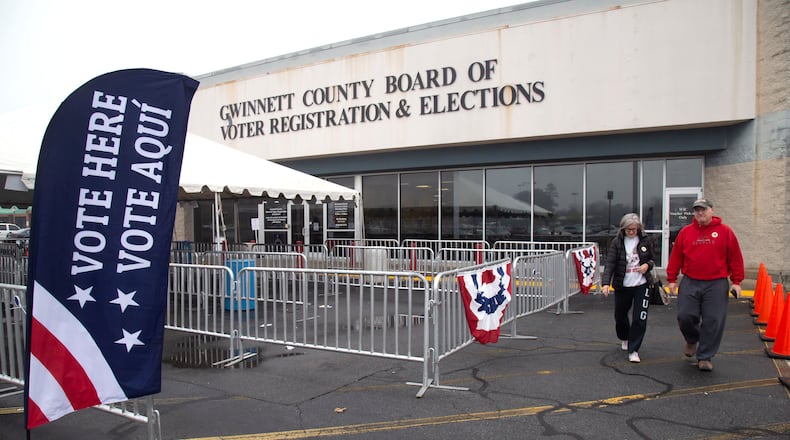 Karen and Tom Koots leave the Gwinnett County voter registration and elections office in Lawrenceville, after casting early ballots on the proposed MARTA expansion into Gwinnett. STEVE SCHAEFER / SPECIAL TO THE AJC