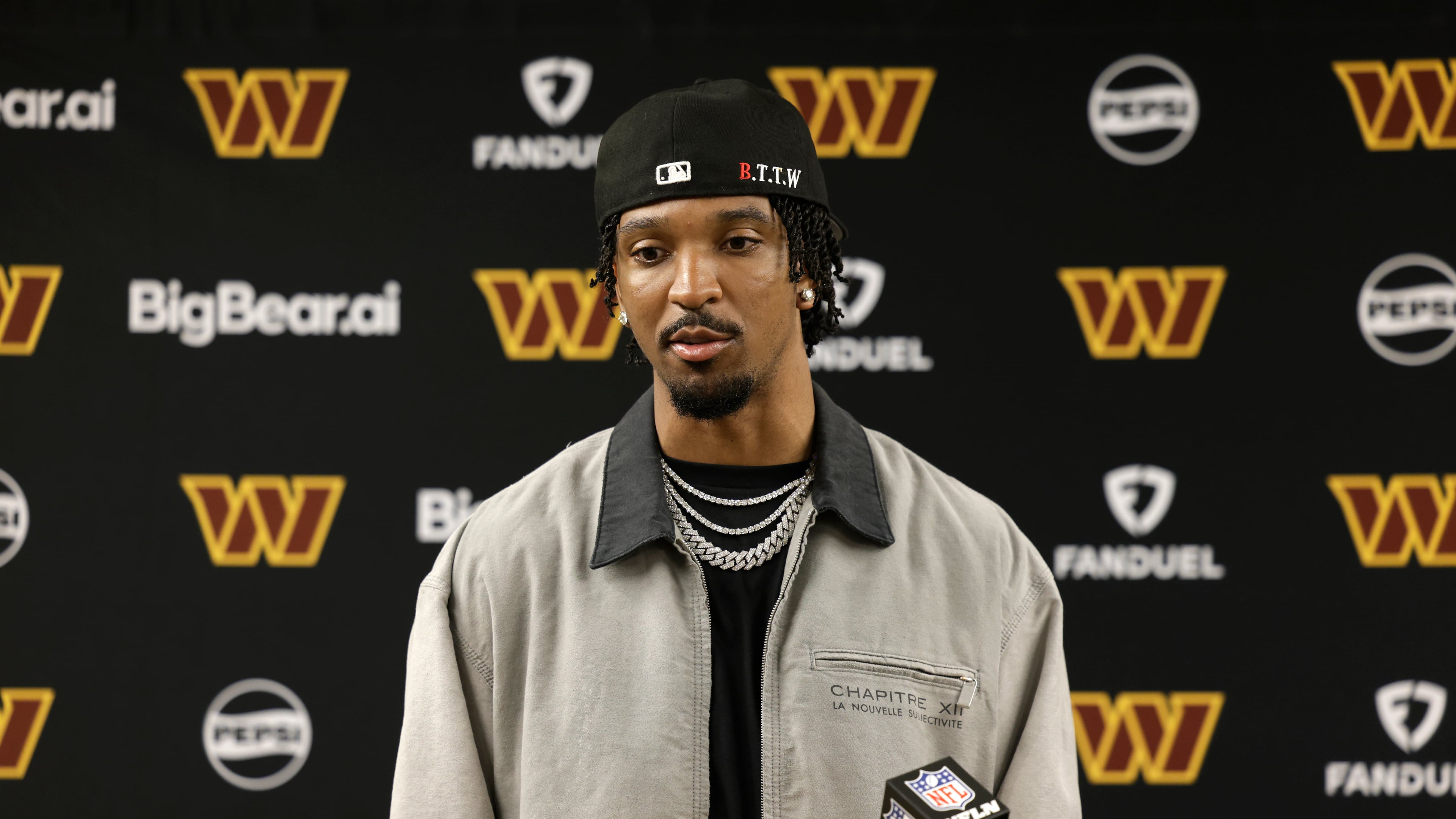 Washington Commanders quarterback Jayden Daniels speaks during a news conference following an NFL football game against the Green Bay Packers Thursday, Sept. 11, 2025, in Green Bay, Wis. (AP Photo/Matt Ludtke)