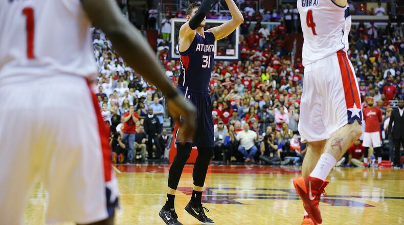 Hawks’ Mike Muscala hits a 3-pointer in the final seconds to tie the game at 101 against the Wizards in their Eastern Conference semifinals Game 3 at the Verizon Center on Saturday, May 9, 2015, in Washington, D.C. The Wizards held on to beat the Hawks with a shot by Paul Pierce as time expired in the game to win 103-101. Curtis Compton / ccompton@ajc.com