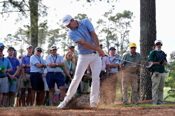 Justin Rose hits from the pine straw on the 15th hole during the first round at the Masters golf tournament, Thursday, April 10, 2025, in Augusta, Ga. (AP Photo/Julia Demaree Nikhinson)