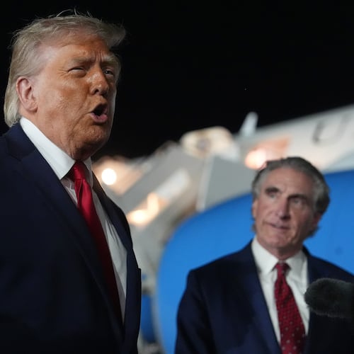 President Donald Trump talks with reporters before boarding Air Force One at John F. Kennedy International Airport in New York, early Tuesday, June 9, 2026, as Interior Secretary Doug Burgum listens. (AP Photo/Mark Schiefelbein)