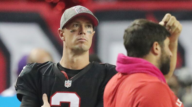 Falcons quarterback Matt Ryan stands on the sidelines after going four and out during over time against the Chargers. Curtis Compton /ccompton@ajc.com