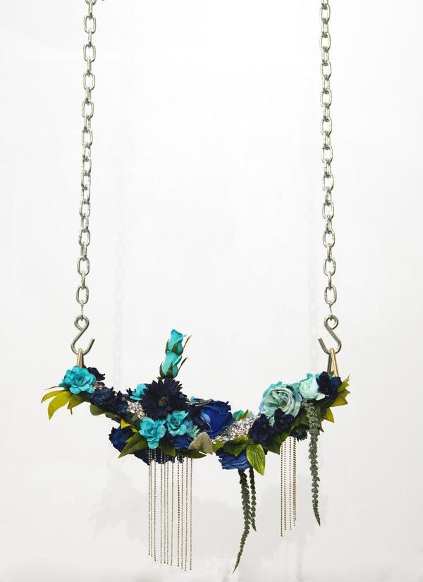 'For Tamir VII' (2019) by Devan Shimoyama; silk flowers, rhinestones, jewelry, canvas, found objects and chains on industrial vinyl swing seat.