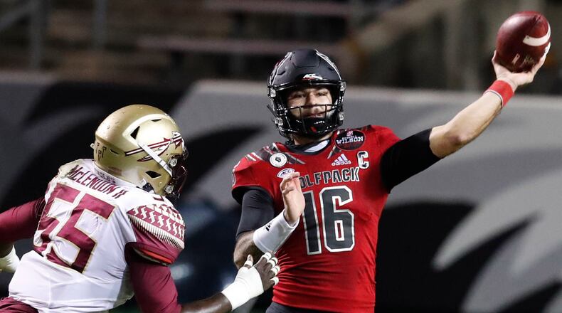 North Carolina State quarterback Bailey Hockman (16) throws as Florida State defensive end Derrick McLendon II (55) pressures him during the first half Saturday, Nov. 14, 2020, in Raleigh, N.C. (Ethan Hyman/The News & Observer)