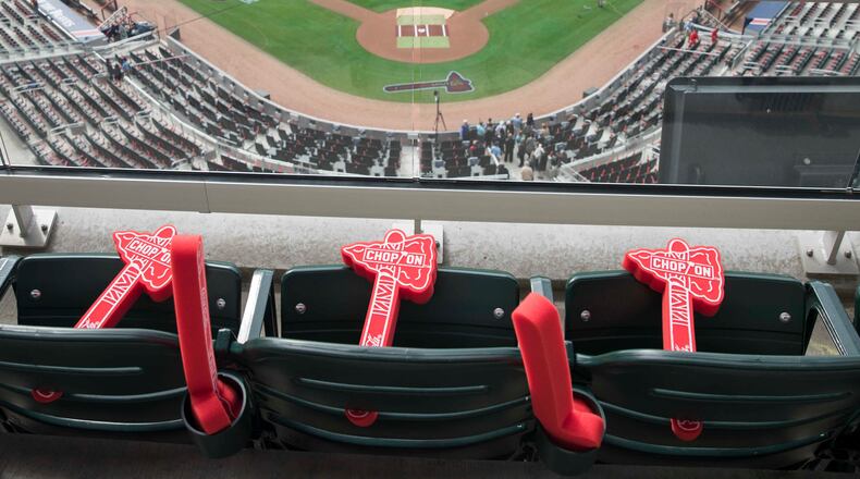 Foam Tomahawks rest on seats  before the Atlanta Braves'  season opener game Thursday, March 29, 2018, in Atlanta.