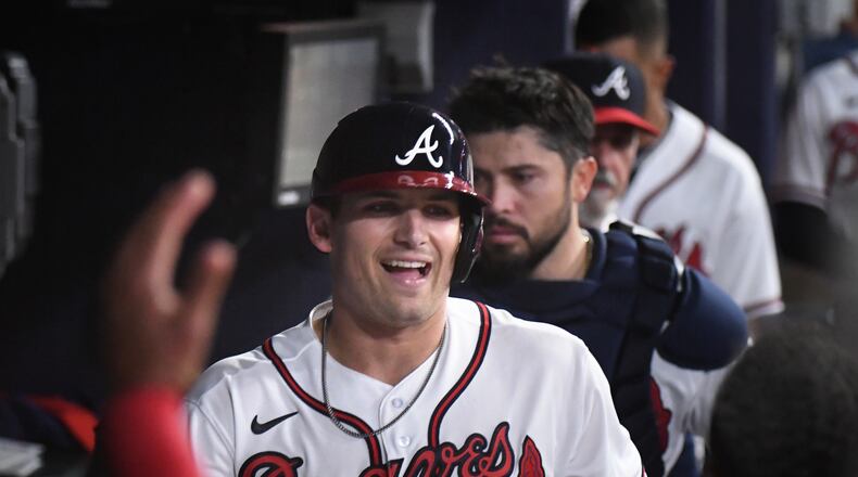 Braves third baseman Austin Riley reacts after hitting a solo homer Saturday at Truist Park. Riley became a father for the first time Wednesday. (Hyosub Shin / Hyosub.Shin@ajc.com)
