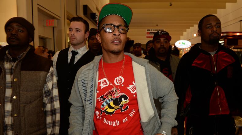 Rapper T.I. makes a special appearance at The PUMA Lab Powered by Foot Locker at Foot Locker at the Gallery at South Dekalb Mall on February 6, 2014 in Atlanta. (Photo by Rick Diamond/Getty Images for PUMA)