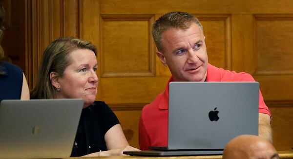 Blogger Aiden Kearney, right, and Canton community cable reporter Andria Galvin talk during a court sidebar while witness snowplow driver Brian Loughran speaks on the stand at Norfolk Superior Court in Dedham, Mass., Tuesday June 3, 2025. (Greg Derr/The Patriot Ledger via AP, Pool)