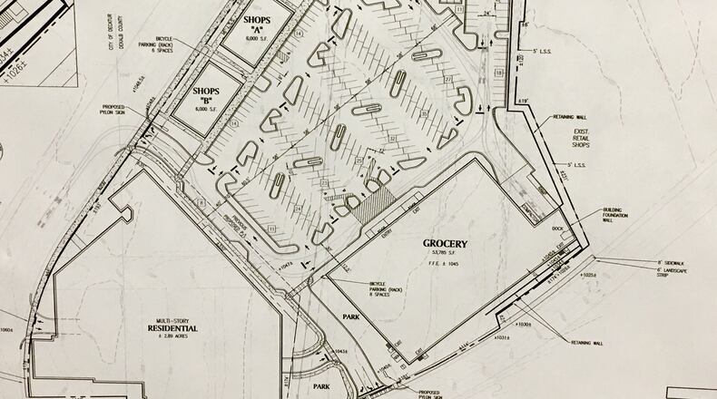 An early version of a proposed development just east of Decatur. It’s comprised of a total 9.78 acres with only 1.4 acres currently within city limits. For the project to commence, the remainder would have to be annexed into the city, a move strongly opposed by at least three DeKalb County commissioners. For now, plans call for 289 apartments fronting the development, a 50,000 square foot grocery (long rumored as a Publix) on East Ponce de Leon Avenue, and two buildings with 12,000 square feet of retail on North Aracadia Drive. Courtesy Alliance Realty