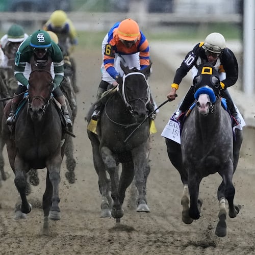 Paco Lopez, right, atop Napoleon Solo, leads the pack to win the 151st running of the Preakness Stakes horse race, Saturday, May 16, 2026, at Laurel Park in Laurel, Md. (AP Photo/Nick Wass)