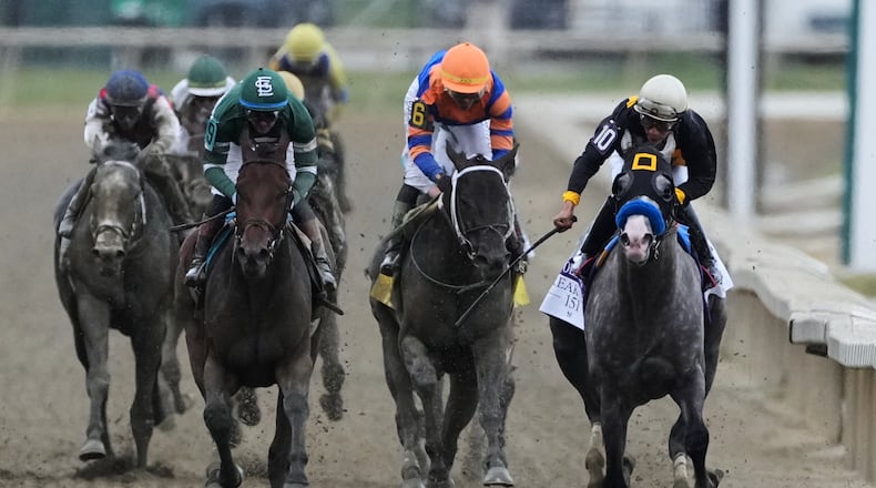 Paco Lopez, right, atop Napoleon Solo, leads the pack to win the 151st running of the Preakness Stakes horse race, Saturday, May 16, 2026, at Laurel Park in Laurel, Md. (AP Photo/Nick Wass)