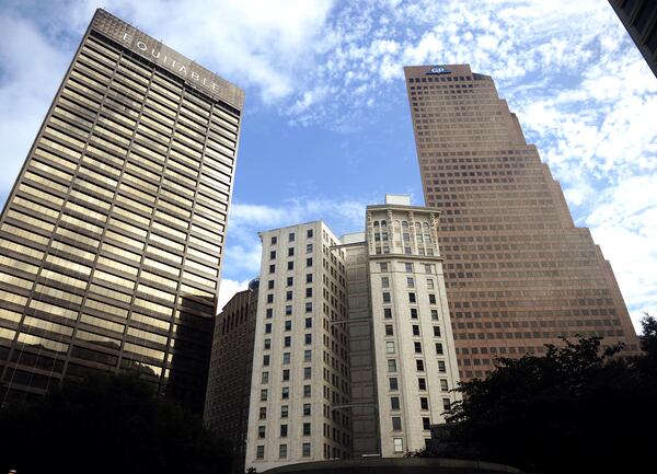 Today, the Candler Building (center, shortest building) is flanked by the Equitable (left) and Georgia-Pacific (right) buildings in downtown Atlanta. (Bita Honarvar/AJC)
