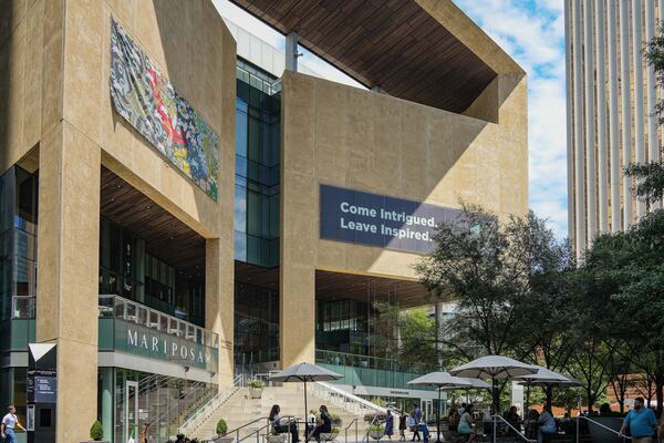 The white, modern facade of the Mint Museum in Charlotte, N.C., is perched above the bustle of the street. (Courtesy)