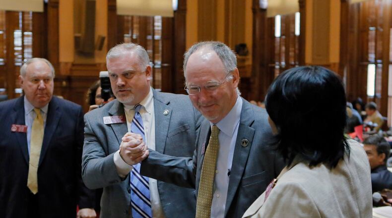 Mar. 28,  2017 - Atlanta - Rep. Allen Peake, R - Macon, is congratulated after the House passed SB 16, which would expand the list of disorders eligible for treatment under the state's nascent medical marijuana program. The chamber voted 167-4 on Tuesday to adopt the bill.  The 39th legislative day of the 2017 General Assembly.   BOB ANDRES  /BANDRES@AJC.COM