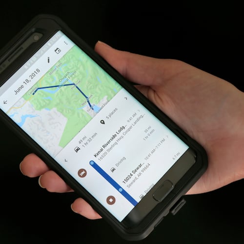 FILE - In this Aug. 8, 2018, file photo, a mobile phone displays a user's travels using Google Maps in New York. (AP Photo/Seth Wenig, File)