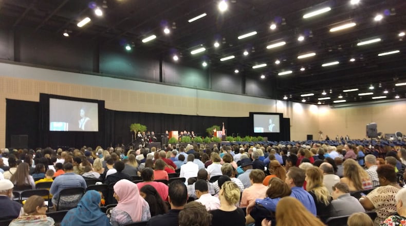 Relatives pack the Cobb Galleria Centre for the 2016 Georgia Cyber Academy graduation ceremony. The school announced the resignation of its superintendent, Angela Lassetter, on March 17, 2022. (Ty Tagami / AJC)