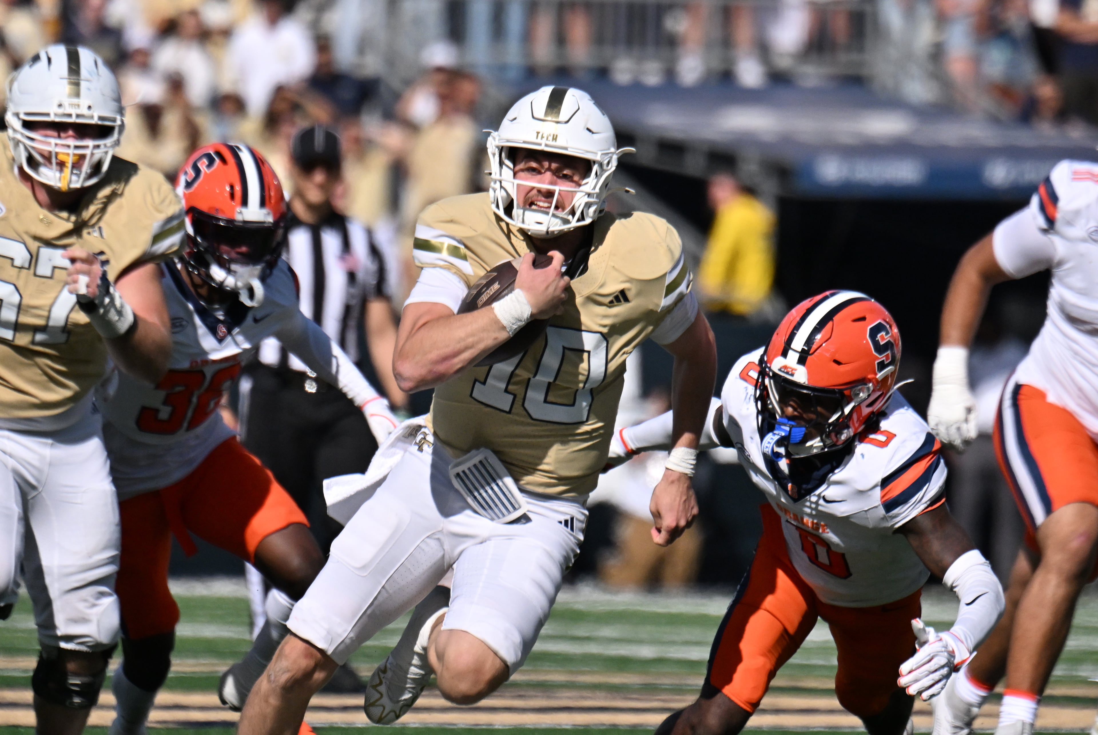 Georgia Tech quarterback Haynes King (center) runs the ball during the second half in an NCAA college football game at Bobby Dodd Stadium, Saturday, Oct. 25, 2025 in Atlanta. Georgia Tech won 41-16 over Syracuse. The Yellow Jackets are 8-0 for the first time since 1966 and 5-0 in the ACC for the first time ever. (Hyosub Shin/AJC)