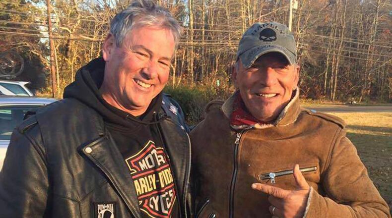 In this Friday, Nov. 11, 2016, photo provided by Ryan Bailey, Dan Barkalow, left, and Bruce Springsteen poses for a photo in Wall Township, N.J. Barkalow and a group from the Freehold American Legion was riding after a Veterans Day event Friday when they pulled over to help a stranded motorcyclist who turned out to be The Boss. (Ryan Bailey via AP)