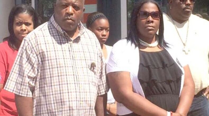 Kenneth and Jackie Johnson, front, on Wednesday filed an amended complaint in their wrongful death suit against school officials, law enforcement. Christian Boone / cboone@ajc.com