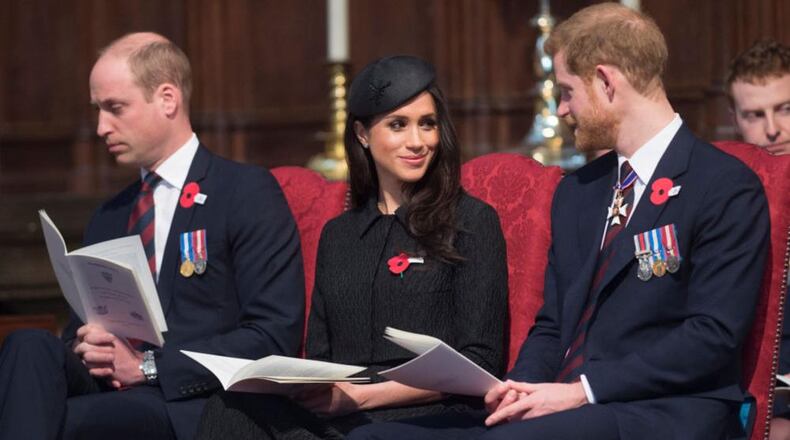 Prince William, left, sits with Meghan Markle and Prince Harry during the Anzac Day service at Westminster Abbey.