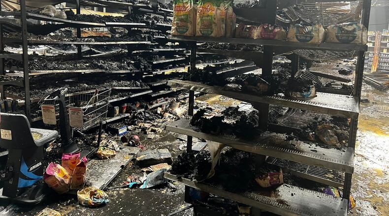 A massive fire in the retail area of the Peachtree City Walmart Supercenter scorched large sections of the store and caused a partial roof collapse overnight Aug. 24.