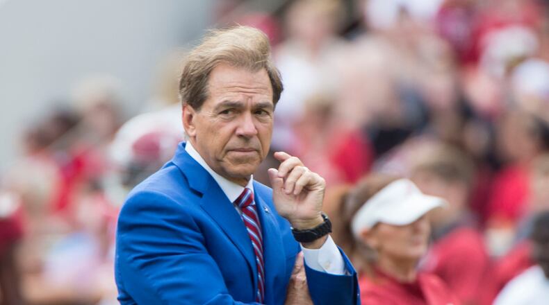 Alabama head coach Nick Saban, here watching his players warm up for a spring game, is blocking the potential transfer of a player to Georgia (Vasha Hunt/ AL.com)