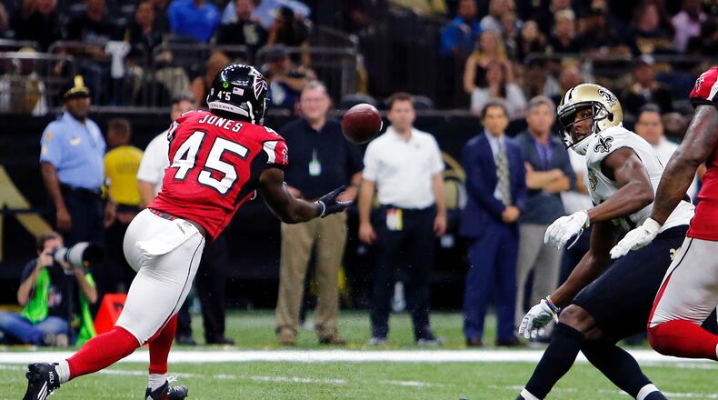 FILE - Atlanta Falcons outside linebacker Deion Jones (45) intercepts a pass from New Orleans Saints quarterback Drew Brees, not pictured, and returns it for a touchdown, in the second half of an NFL football game in New Orleans, on Sept. 26, 2016. (AP Photo/Butch Dill, File)