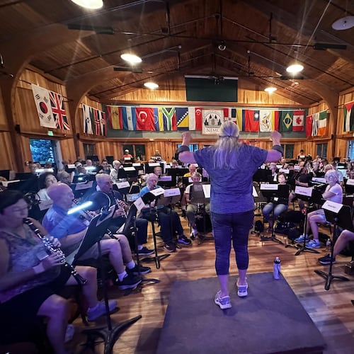 This photo provided by Russ Grazier shows conductor Debbi Gibson leading a band rehearsal at the New England Adult Music Camp in Sidney, Maine, in August 2025. (Russ Grazier via AP)