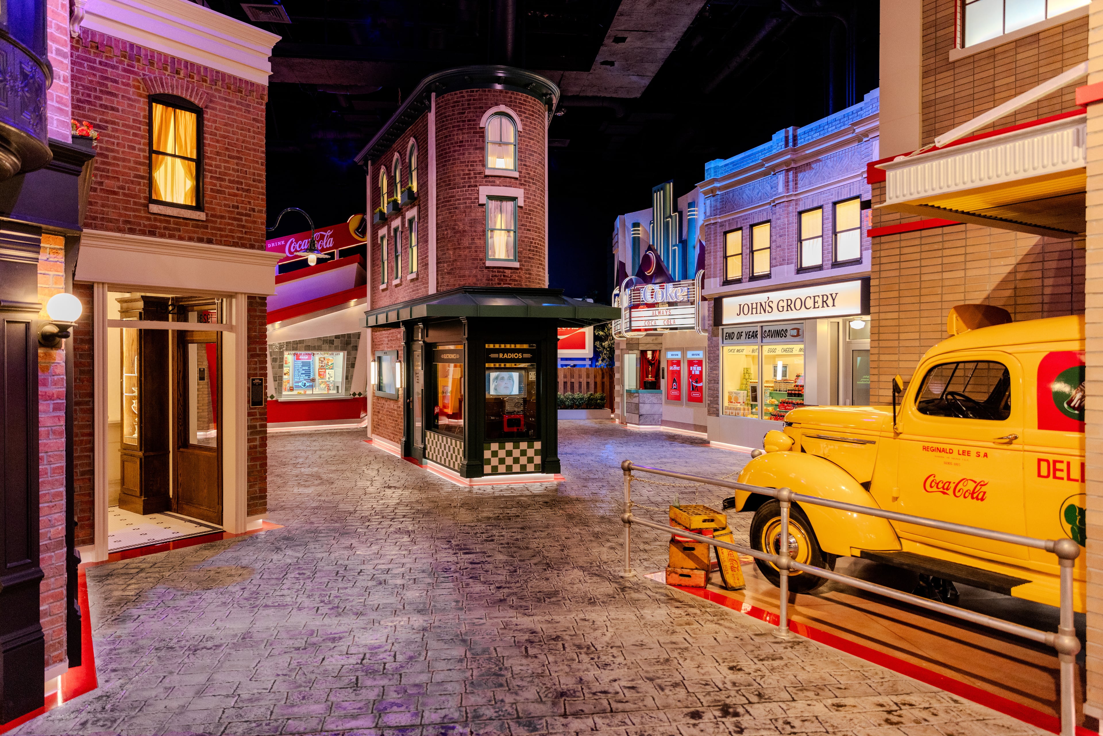 The second half of "Coca-Cola Stories" is a mock city with multiple interactive experiences that utilize artificial intelligence. On the corner of the mock city is Jacob's Pharmacy. Courtesy of World of Coca-Cola