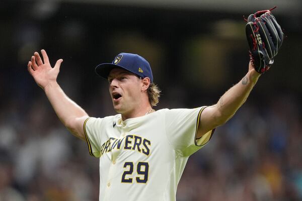 Milwaukee Brewers' Trevor Megill gestures after recording a save during the ninth inning of a baseball game against the Los Angeles Dodgers, Tuesday, July 8, 2025, in Milwaukee. (AP Photo/Aaron Gash)