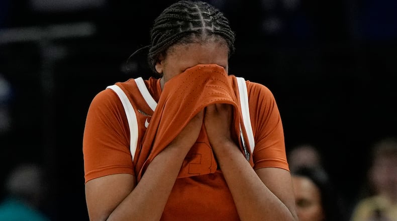 Texas forward Madison Booker (35) reacts after Texas lost to UCLA in a women's NCAA college basketball tournament semifinal game at the Final Four, Friday, April 3, 2026, in Phoenix. (AP Photo/Ross D. Franklin)