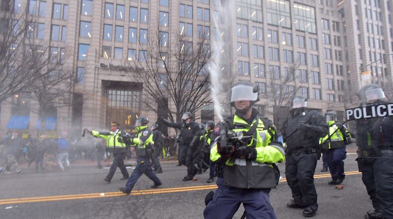 AJC Multimedia photojournalist Hyosub Shin was pepper sprayed while covering Inauguration protests in Washington D.C. Friday, Jan. 20, 2017