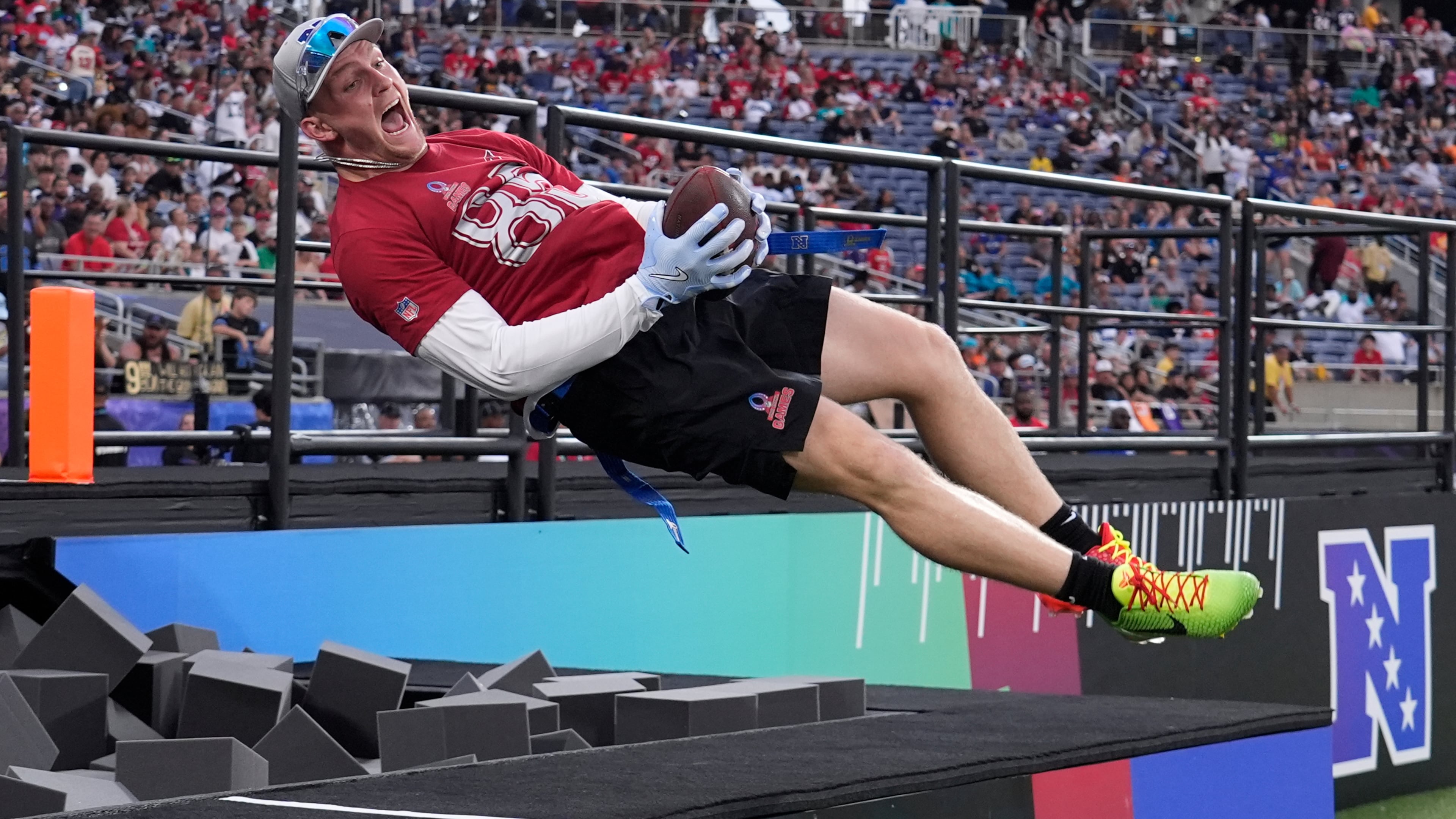 FILE - Arizona Cardinals tight end Trey McBride celebrates his touchdown jumping in a foam pit during the NFL Pro Bowl football game, Feb. 2, 2025, in Orlando, Fla. (AP Photo/John Raoux, File)