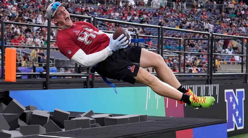 FILE - Arizona Cardinals tight end Trey McBride celebrates his touchdown jumping in a foam pit during the NFL Pro Bowl football game, Feb. 2, 2025, in Orlando, Fla. (AP Photo/John Raoux, File)