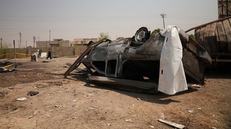 A damaged vehicle at the site of an airstrike on a Popular Mobilization Forces base in Mosul, Iraq, Wednesday, July 29, 2026. (AP Photo/Farid Abdulwahed)
