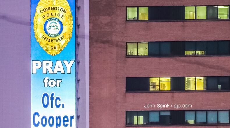 A message of support is displayed on the Corey Airport Advertising Tower on the Downtown Connector. The digital billboard is within view of wounded Covington police Officer Matt Cooper's room at Grady Memorial Hospital.