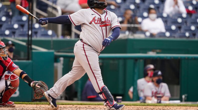 Atlanta Braves' Pablo Sandoval watches his two-run homer during the seventh inning of the second baseball game of a doubleheader against the Washington Nationals, at Nationals Park, Wednesday, April 7, 2021, in Washington.The Braves won the second game 2-0. (AP Photo/Alex Brandon)