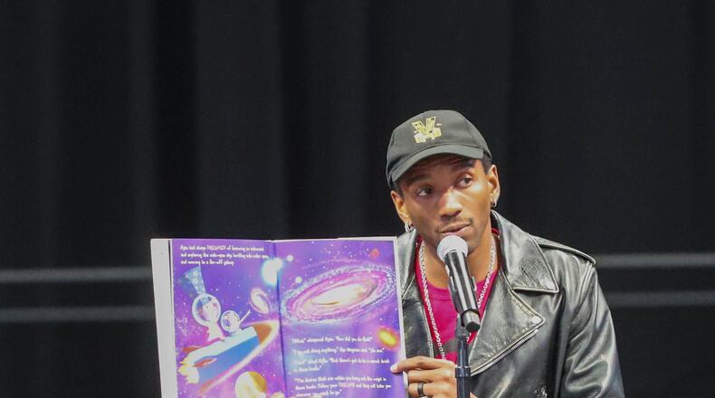 Former University of Georgia and New England Patriots wide receiver Malcolm Mitchell reads his book, "The Magician's Hat" on Tuesday, October 17, 2023 during a Reading Rally at Enmarket Arena.
