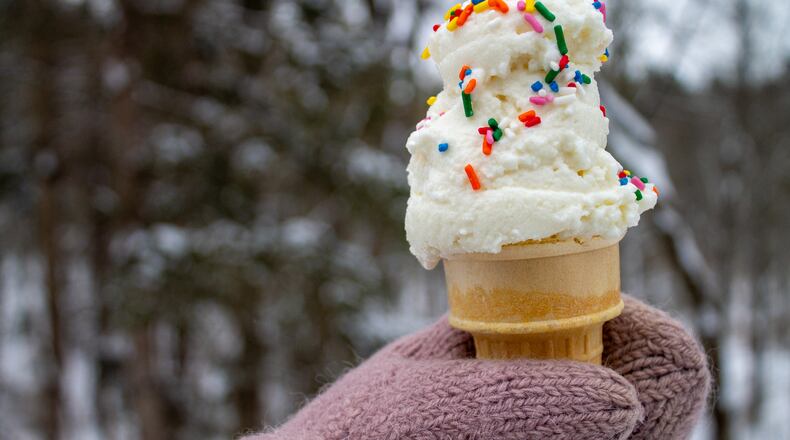 A cone of snow cream, made by mixing sweetened condensed milk with fresh snow, is seen Tuesday, Jan. 27, 2026, in Bow, N.H. (AP Photo/Holly Ramer)