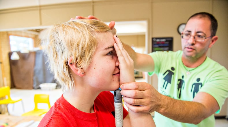 A math lesson turns real world application for Emma Grace (left) as Christian Zsilavetz explain Leonardo Da Vinci's Golden Ratio at the Unitarian Universalist Congregation of Atlanta on Thursday, December 10, 2015. JONATHAN PHILLIPS / SPECIAL