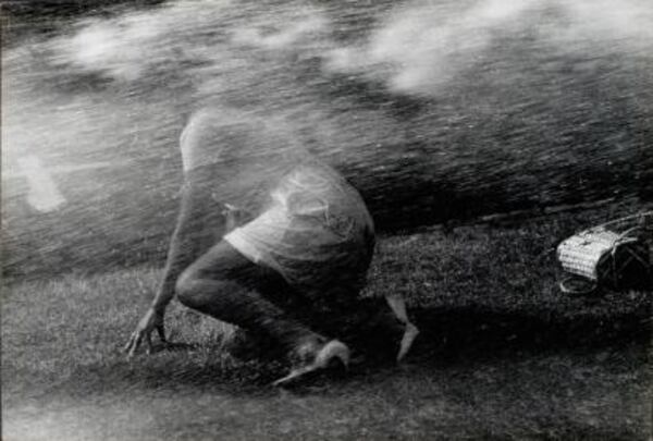 Among the civil rights photographers featured in the show is Charles Moore, who shot this memorable picture of a woman getting fire-hosed in Birmingham in 1963.