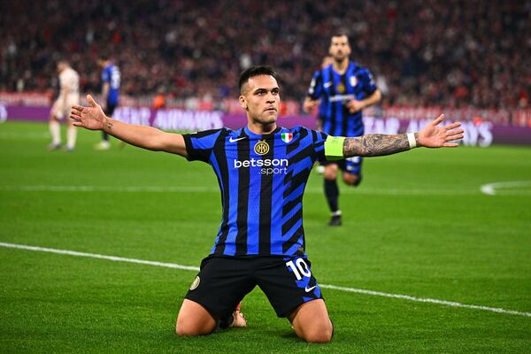 Inter Milan's Lautaro Martinez celebrates after scoring the opening goal during the Champions League quarterfinals first leg soccer match between FC Bayern Munich and Inter Milan, at the Allianz Arena in Munich, Germany, Tuesday, April 8, 2025. (Tom Weller/dpa via AP)
