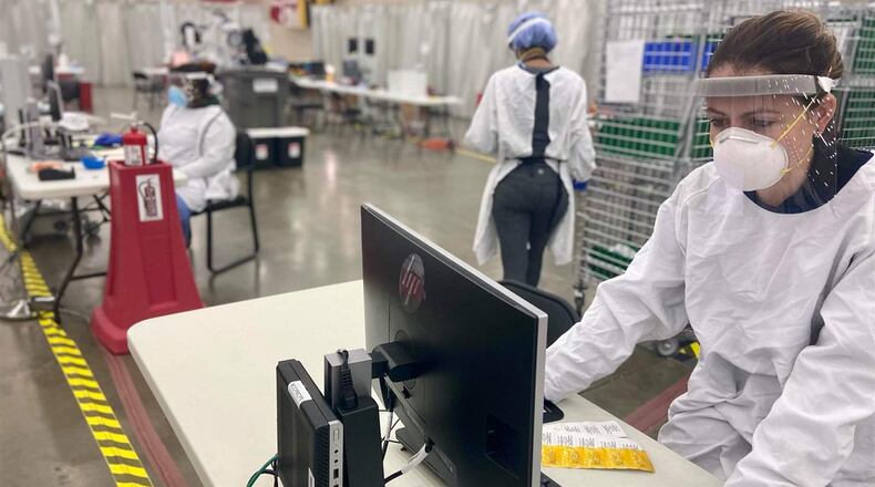 Chief pharmacist Glorimar Rivera at work at the Baltimore Convention Center Field Hospital last November. The hospital was set up in April 2020 by the state of Maryland and Baltimore in partnership with the University of Maryland and Johns Hopkins health systems. It is one of a number of partnerships the city entered into in response to COVID-19 that many credit with helping Baltimore avoid a worse experience with the pandemic. (Courtesy Baltimore Convention Center Field Hospital/Pew Charitable Trusts/TNS)