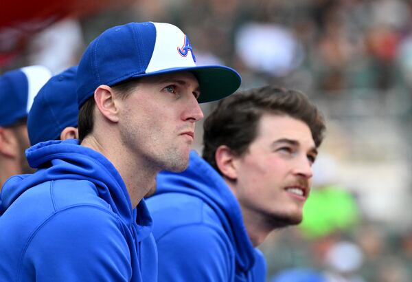 Braves injured pitchers Kyle Wright (left) and Max Fried sit in the dugout during the second inning at Truist Park, Saturday, May 27, 2023, in Atlanta. (Hyosub Shin / Hyosub.Shin@ajc.com)