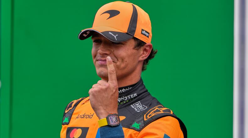 McLaren driver Lando Norris of Britain reacts after winning the pole position in the qualifying for the Formula One Dutch Grand Prix in Zandvoort , Netherlands, Saturday, Aug. 22, 2026. (AP Photo/Darko Bandic)