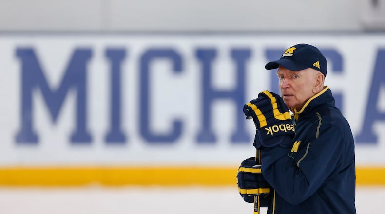 FILE - Michigan hockey coach Red Berenson watches NCAA college hockey practice in Ann Arbor, Mich., Tuesday, March 22, 2016. (AP Photo/Paul Sancya, File)