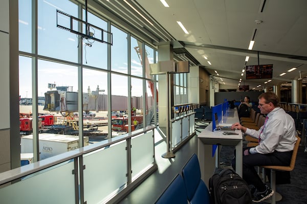 Hartsfield-Jackson Atlanta International Airport expands for the first time in a decade with the addition of five passenger gates on Concourse T.  Updated signage shows the addition of gates T17 - T21 on Thursday, Nov 17, 2022.  The area's circular atrium skylight, lounge seating options, large windows and digital information boards provide for United passengers.  (Jenni Girtman for The Atlanta Journal-Constitution)