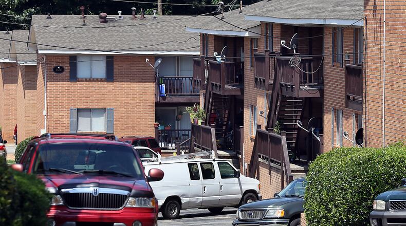 JULY 17, 2013-SANDY SPRINGS: Photo of The Chastain Apartments near Roswell road & Windsor Parkway that could be replaced by the Sandy Springs Gateway project, on Wednesday July 17th, 2013. Sandy Springs has given the green light to the $120 million development it says will upgrade one of its major corridors. The City Council voted 5-1 Tuesday to allow JLB Realty permits to build a mixed-use development with 630 high-end apartments, retail and office space. The vote came over the objections of nearby residents who claim the city is going back on its commitment to preserve neighborhoods. PHIL SKINNER / PSKINNER@AJC.COM