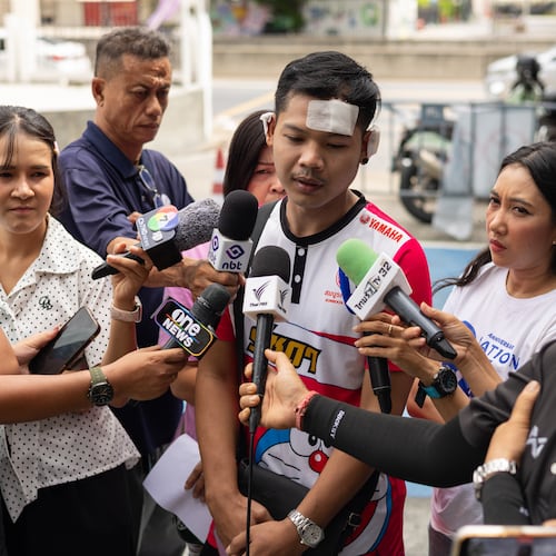 Natthaphong Lakhorn, a 26-year-old survivor of the Rong Beer Na Ladprao bar fire, speaks to journalists outside the Phahonyothin Police Station in Bangkok, Thailand, Wednesday, July 15, 2026. (AP Photo/Anton L. Delgado)