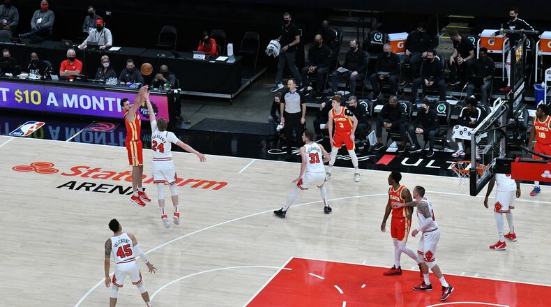 Hawks forward Danilo Gallinari (left) shoots over Chicago Bulls forward Lauri Markkanen (24) during the first half in an NBA basketball game at State Farm Arena on Saturday, May 1, 2021. (Hyosub Shin / Hyosub.Shin@ajc.com)